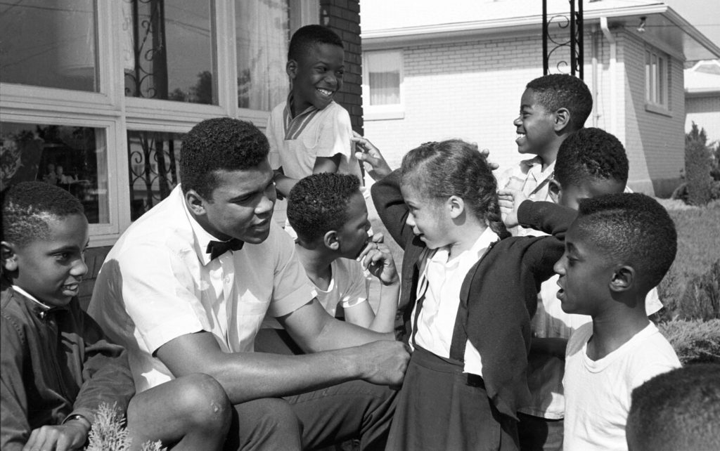 Cassius Clay (later Muhammad Ali) and Lonnie Williams (later Ali) in Louisville in 1963, when he was 21 and she was 6. CreditSteve Schapiro/Corbis, via Getty Images