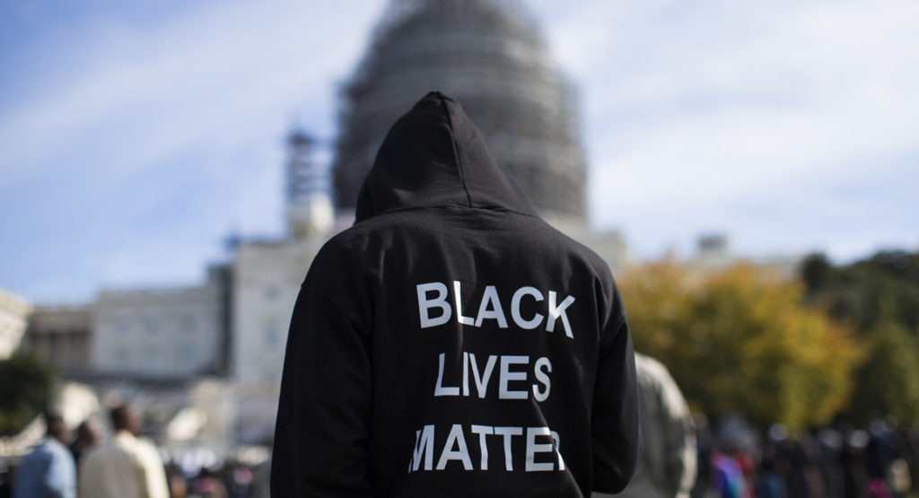 Neal Blair wears a hoodie that reads "Black Lives Matter" as he stands on the lawn of the Capitol during a rally to mark the 20th anniversary of the Million Man March on Oct. 10, 2015, in Washington. | AP Photo | AP Photo Read more: http://www.politico.com/story/2015/11/major-donors-consider-funding-black-lives-matter-215814#ixzz4E7cFBiMO Follow us: @politico on Twitter | Politico on Facebook